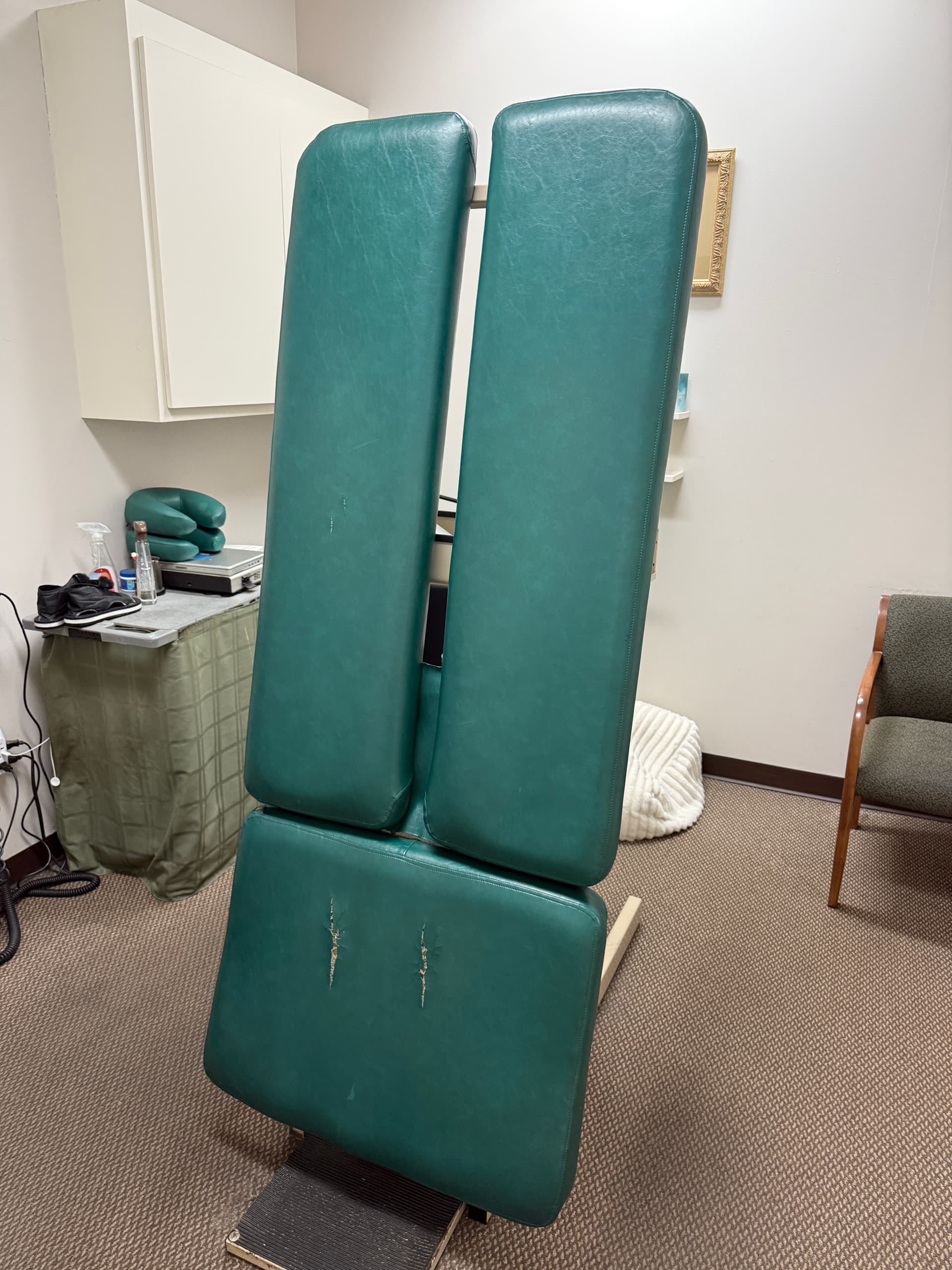 Chiropractic adjustment table before upholstery restoration