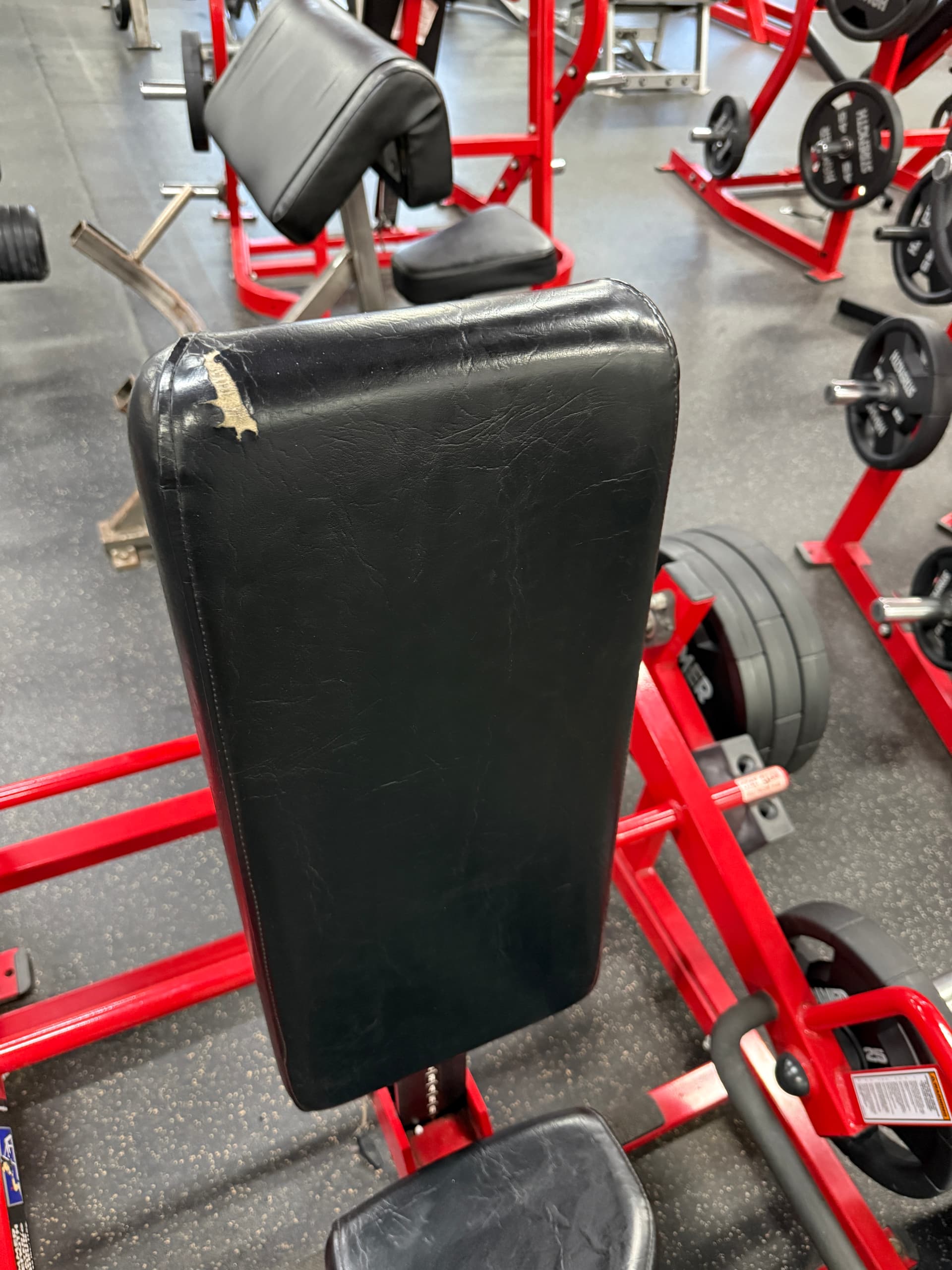 Commercial black strength machine before upholstery restoration