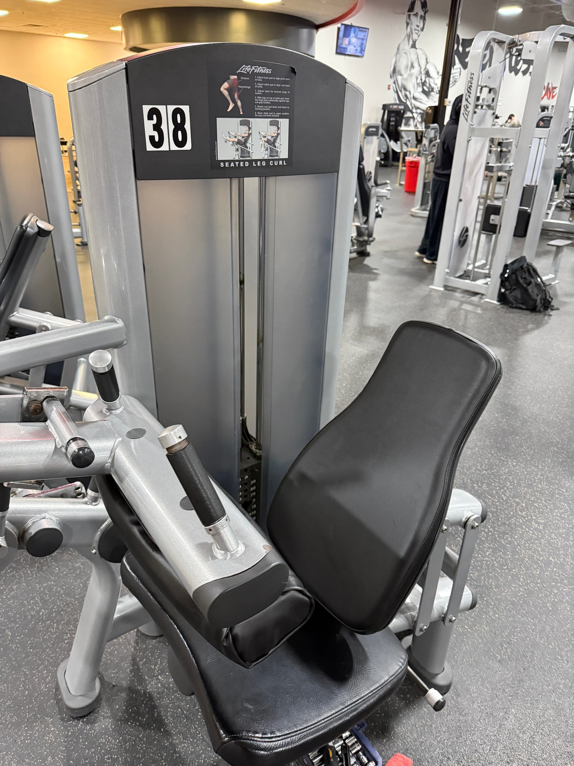 Freshly restored black upholstery on a commercial gym machine